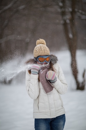 Girl playing in the snowの写真素材