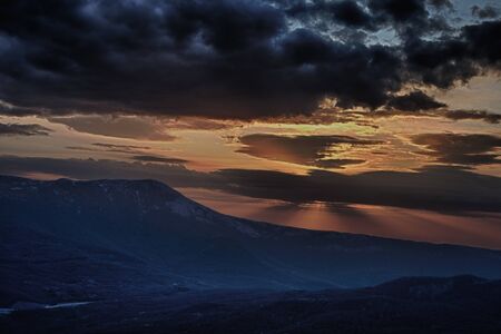 Sunset in the Crimean mountains overlooking the seaの写真素材