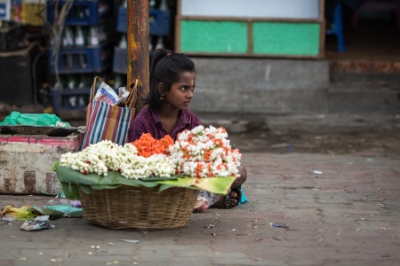 Indian girl selling flowers in the streetのeditorial素材