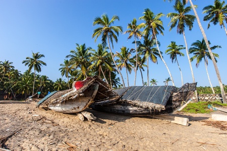 Old boat on the beach of Varkalaの写真素材