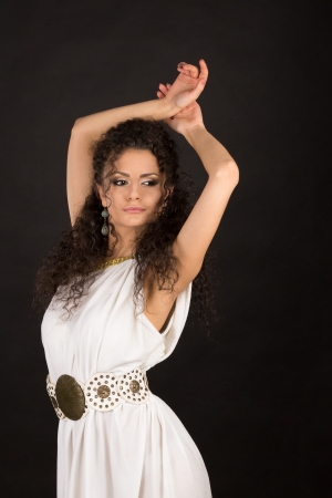 Portrait of a pretty young brunette in white greece togaの写真素材