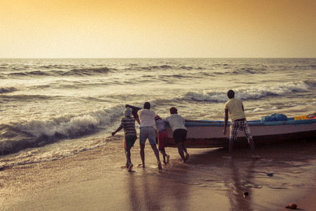 CHENNAI, INDIA-FEBRUARY 10: Fishermen on the beach Marina Beach on February 10, 2013 in Chennai, India. The beach runs from near Fort St. George in the north to Besant Nagar in the south, a distance of 13Â km.のeditorial素材
