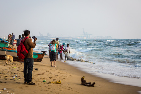 CHENNAI, INDIA-FEBRUARY 10: Fishermen on the beach Marina Beach on February 10, 2013 in Chennai, India. The beach runs from near Fort St. George in the north to Besant Nagar in the south, a distance of 13Â km.のeditorial素材