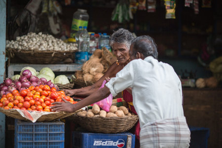 MADURAI, INDIA-FEBRUARY 15: Trader on the street of Indian town on February 15, 2013 in Madurai,...