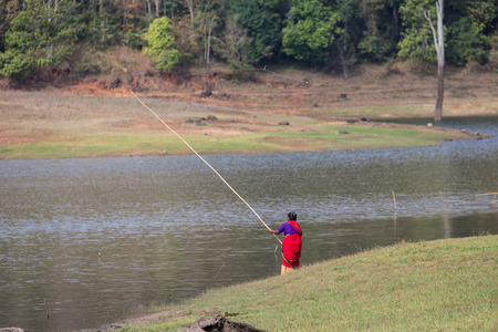 PERIYAR WILDLIFE SANCTUARRY, INDIA-FEBRUARY 20: Fisheman 20, 2013 in Periyar Wildlife Sancturary, India. Fisherman on the National Park.のeditorial素材