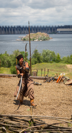 ZAPORIZHIA, UKRAINE-JUNE 21: Ukrainian Cossacks 21, 2014 in Zaporizhia, Ukraine. Show of Ukrainian Cossacks in Cossacks Museum on the island of Khortytsyaのeditorial素材
