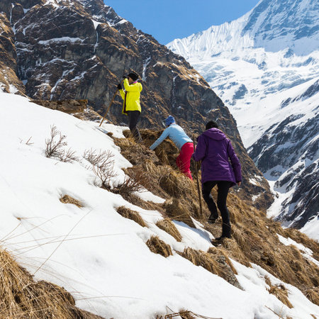 NARCHYANG, NEPAL-MARCH 23: A group of tourists 23, 2015 in Narchyang, Nepal. A group of tourists on a route to the Annapurna  base camp.のeditorial素材