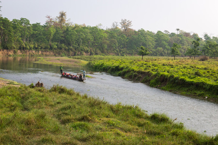 CHITWAN, NEPAL-MARCH 27: Boat safari 27, 2015 in Chitwan, Nepal. Ð¡anoe safari in the Chitwan National Park., INDIA-のeditorial素材