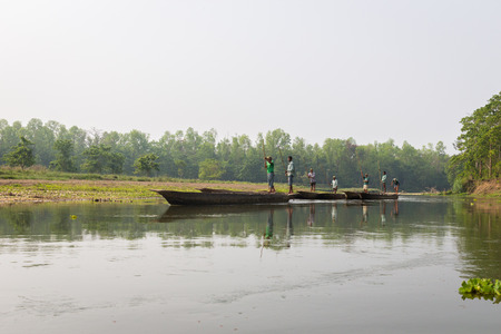 CHITWAN, NEPAL-MARCH 27: Boat safari 27, 2015 in Chitwan, Nepal. Ð¡anoe safari in the Chitwan National Park., INDIA-のeditorial素材