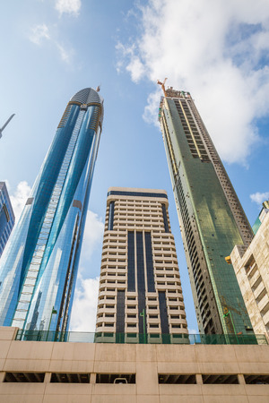 DUBAI, UAE-JANUARY 16: Skyscrapers in the city center on January 16, 2014 in Dubai, UAE. Modern skyscrapers in the city center.のeditorial素材