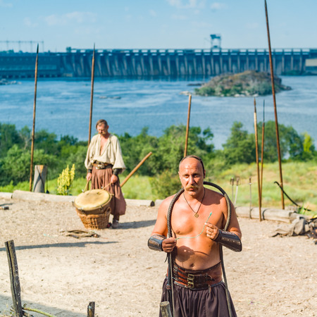 ZAPORIZHIA, UKRAINE-JUNE 25: Ukrainian Cossacks 25, 2016 in Zaporizhia, Ukraine. Show of Ukrainian Cossacks in Cossacks Museum on the island of Khortytsyaのeditorial素材