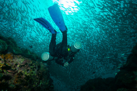 Scubadiver in a sidemount configuration of equipmentの写真素材