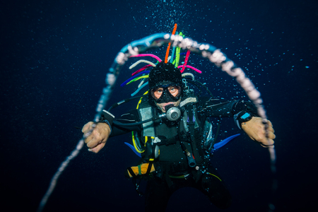 The scuba diver blows the air ringsの写真素材