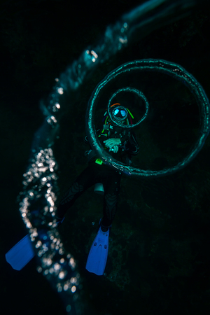 The scuba diver blows the air ringsの写真素材