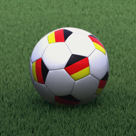 football branded with the German flag on green grassの写真素材