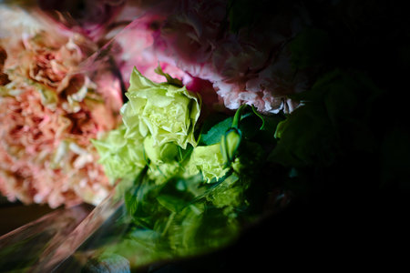 Background for a holiday card for Valentine's Day or March 8. Flowers on a dark background on a wooden old table.の写真素材