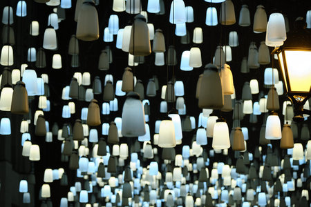 many lanterns hang in the sky above winter street