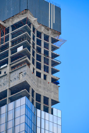 Skyscraper construction. Close up. Against the sky