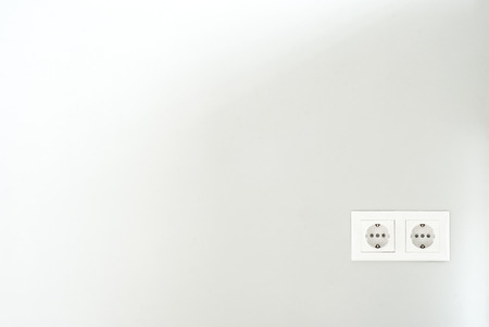 White socket. Power socket. White outlet on the wall.の写真素材
