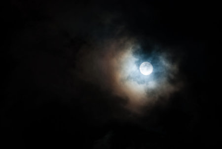 The dark sky with the moon. Full moon