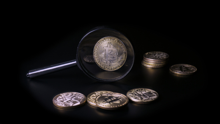 A look at the bitcoin through a magnifying glass. Concept Valuationの写真素材