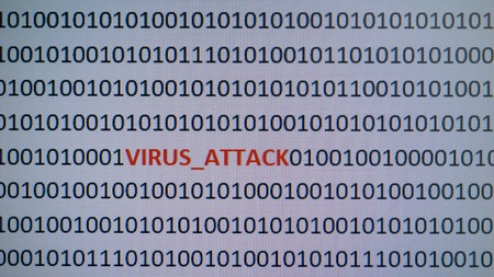 macro computer screen shot with binary code and warning text, concept for computer, technology and online security.の写真素材