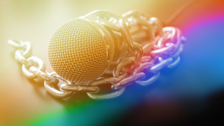 Microphone and chain. Freedom of the press is at risk concept - World press freedom day conceptの写真素材