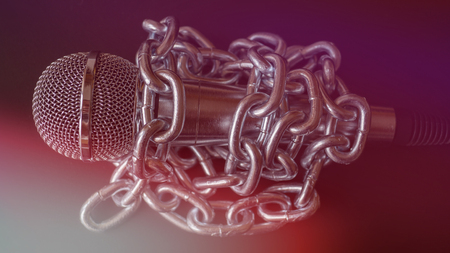 Microphone and chain. Freedom of the press is at risk concept - World press freedom day conceptの写真素材