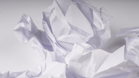 crumpled paper on white table brainstorming in the office conceptの写真素材