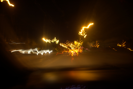 Traffic lights. Long exposure. Night city roads. Speed of lifeの写真素材