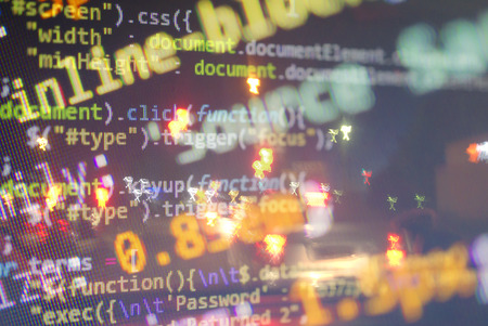 City street with binary code numbers on motion blurred asphalt road , speed and faster digital matrix technology information concept .の写真素材