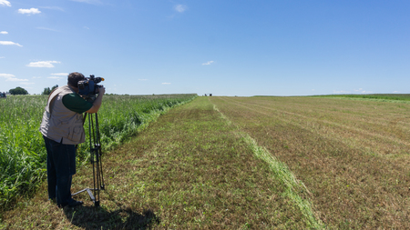 The cameraman shoots the forage preparation process on the camera. Agricultureの写真素材