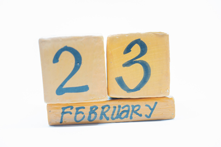 February 23rd. Day 23 of month, handmade wood cube calendar isolated on white background. Winter month, day of the year conceptの写真素材