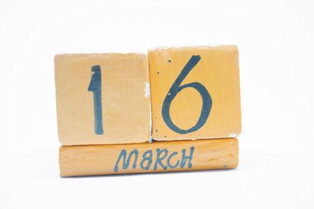march 16th. Day 16 of month, handmade wood cube calendar isolated on white background. Spring month, day of the year concept.の写真素材