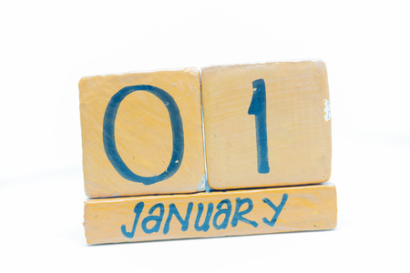 January 1st. Day 1 of month, handmade cube wooden calendar. Winter time, New year conceptの写真素材