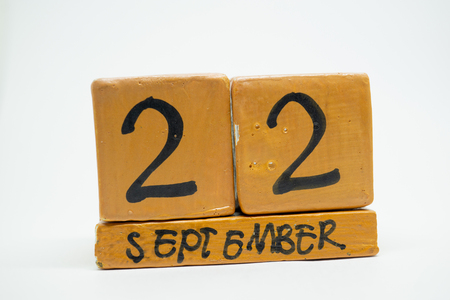 september 22nd. Day 22 of month, handmade wood cube calendar isolated on white background. autumn month, day of the year concept.の写真素材