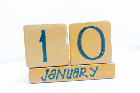 January 10th. Day 10 of month, handmade cube wooden calendar. Winter time, year conceptの写真素材