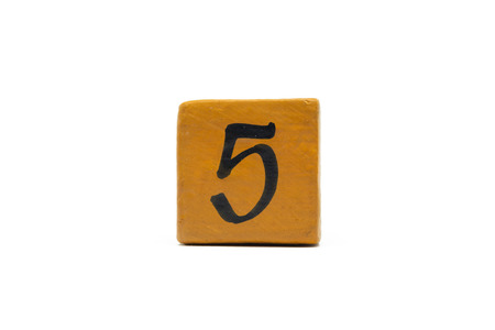 Number five on cube of wooden material isolated on whiteの写真素材