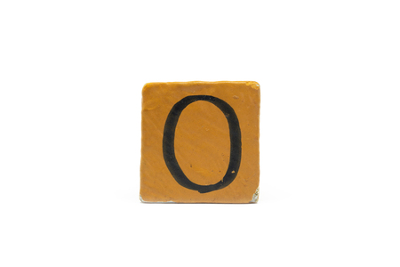Number zero on cube of wooden material isolated on whiteの写真素材