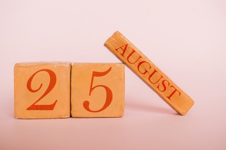 august 25th. Day 25 of month, handmade wood cube calendar  on modern color background. summer month, day of the year concept.の写真素材