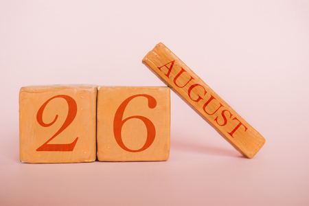 august 26th. Day 26 of month, handmade wood cube calendar  on modern color background. summer month, day of the year concept.の写真素材