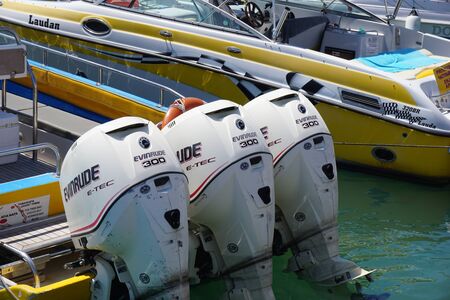 Aya Napa, Cyprus - September, 10, 2015: Rent a boat. Three powerful engines Evinrude 300 mounted on the speedboat.のeditorial素材