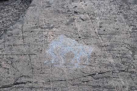 Petroglyph Primitive drawings on stones. Ancient art by prehistoric humans.の写真素材