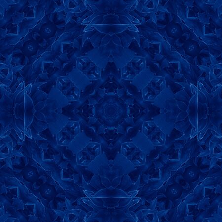 Classic Blue kaleidoscope geometrical ornament abstract background. Trendy color concept of the year. 2020 trend.の写真素材