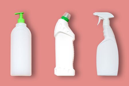 3 types of plastic bottles for household chemicals. Packaging for liquids. Empty, clean white plastic containers. Top view on a pink pastel backgroundの写真素材