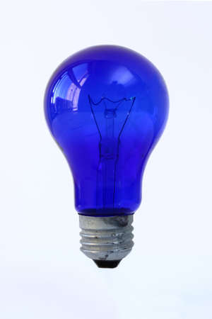 Blue light bulb on a white surface.の写真素材