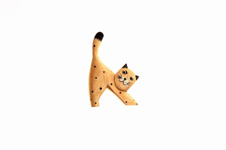 Wooden toy cat on a white backgroundの写真素材