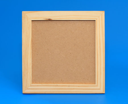 Isolated wooden frame on a blue background