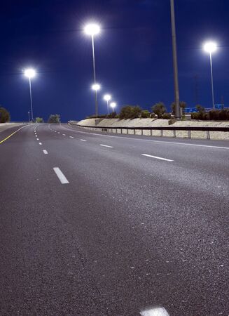 Empty highway at night without people and carsの写真素材