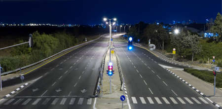 Empty highway at night without people and carsの写真素材